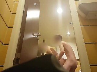 Strangers having sex in public restroom